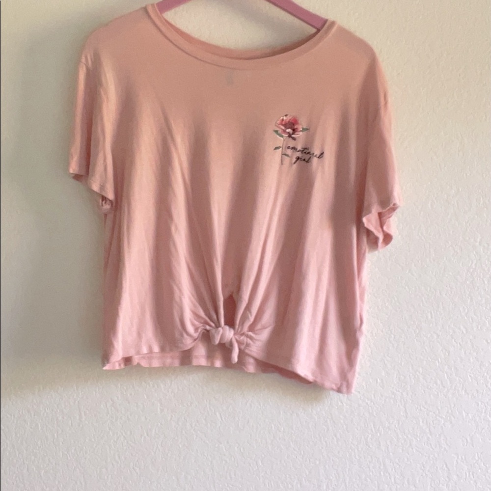 H&M light pink crop top says “emotional girl”